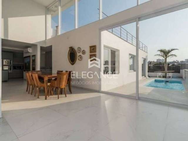 Elegance imóveis vende casa moderna 3 dormitórios suíte pátio com piscina 6 vagas box/garagem Chacara das Pedras Porto Alegre. Comprar R$ 2.700.000,00