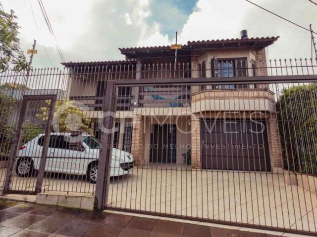 Casa com 4 quartos à venda na Travessa Porto Príncipe, 50, Jardim Lindóia, Porto Alegre, 303 m2 por R$ 1.750.000