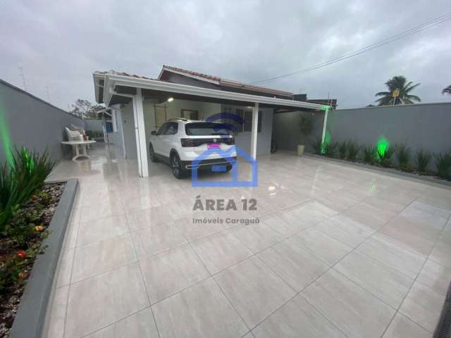 Casa à venda no bairro Getuba em Caraguatatuba, SP - 2 dormitórios, garagem, quintal, a 300 m da ro