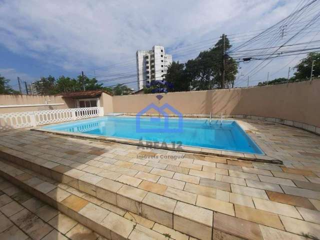 Casa à venda no bairro Jardim Aruan em Caraguatatuba, SP - 3 dormitórios sendo 1 suíte, piscina, ga