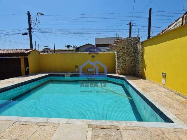 Casa ampla com piscina à Venda no bairro Indaiá em Caraguatatuba, SP - 4 suítes, 6 banheiros, área