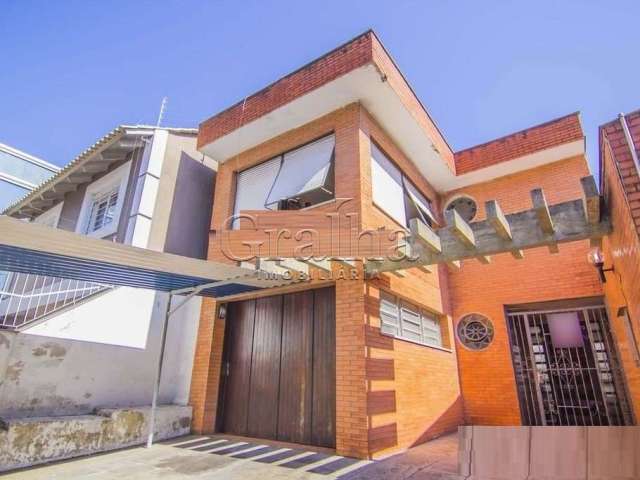 Casa com 4 quartos à venda na Rua Eudoro Berlink, 482, Auxiliadora, Porto Alegre por R$ 1.500.000