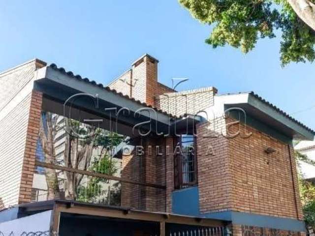 Casa com 3 quartos à venda na Avenida América, 268, Auxiliadora, Porto Alegre por R$ 1.170.000