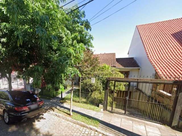 Casa com 4 quartos à venda na Rua Alcebíades Antônio dos Santos, 513, Nonoai, Porto Alegre por R$ 980.000