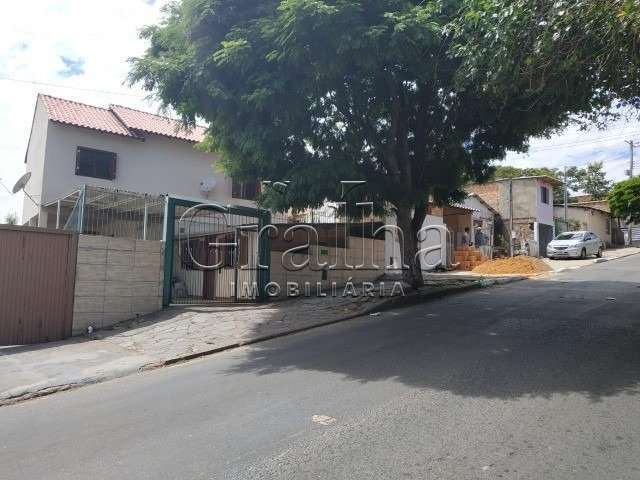 Casa com 3 quartos à venda na Rua Nove de Junho, 612, Vila São José, Porto Alegre por R$ 280.000