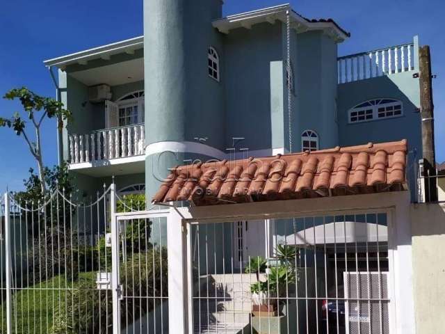 Casa com 3 quartos à venda na Rua Graciano Azambuja, 341, Partenon, Porto Alegre por R$ 1.150.000