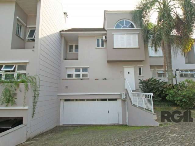 Casa em condomínio na beira do Guaíba com piscina, churrasqueira e linda vista para o rio.&lt;BR&gt;A casa possui três dormitórios, sendo um suíte, banheiro social, living dois ambientes, cozinha, áre