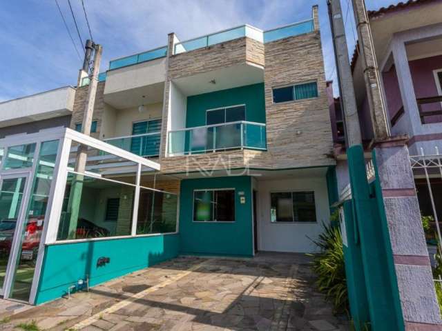 Casa em condomínio fechado com 3 quartos à venda na Rua Angico, 114, Hípica, Porto Alegre por R$ 599.000