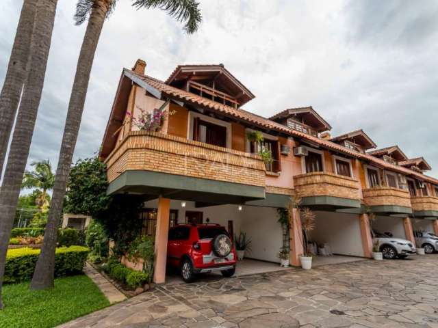 Casa em condomínio fechado com 3 quartos à venda na Rua Sargento Nicolau Dias de Farias, 175, Tristeza, Porto Alegre por R$ 1.185.000