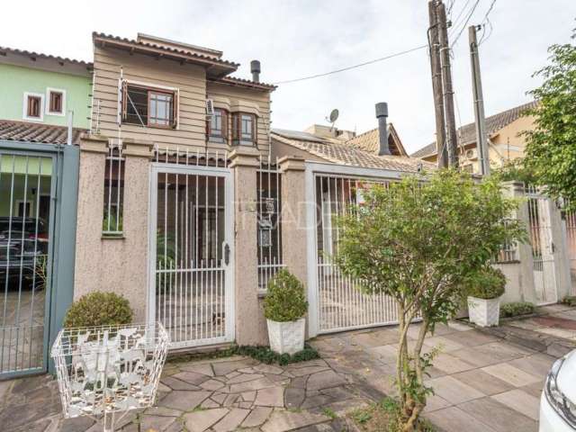 Casa com 3 quartos à venda na Rua Norival Paranaguá de Andrade, 41, Hípica, Porto Alegre por R$ 585.000