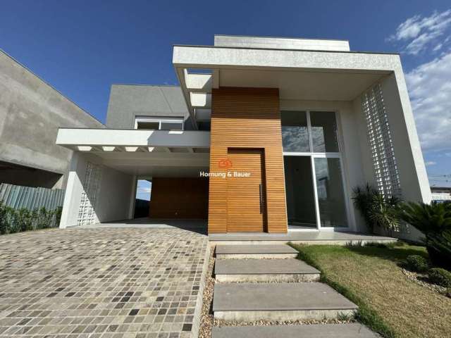 Casa à venda em Condomínio fechado, Nelsi Haas no Centro de Portão - com três Suítes e piscina.