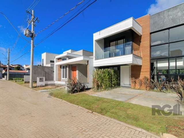 Condomínio fechado - 02 quadras do Zaffari Ipanema&lt;BR&gt;Casa 3 Suítes. Living com amplas aberturas, pé direito duplo, lareira, cozinha americana, churrasqueira integrado ao pátio privativo. Mezani