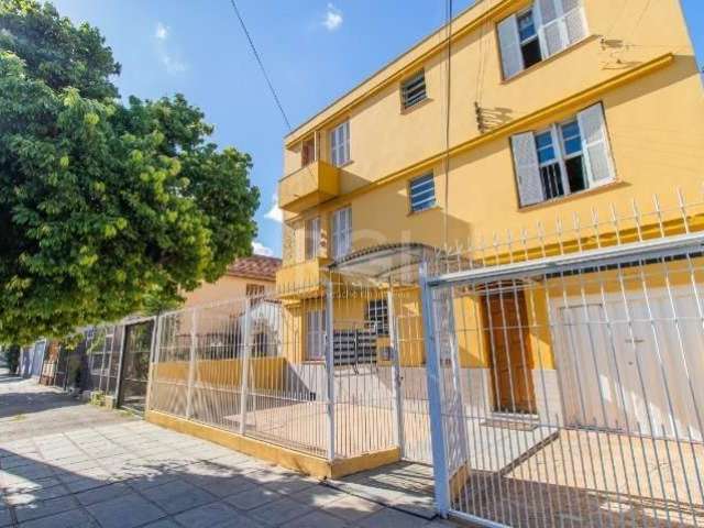 Apartamento térreo semimobiliado de 2 dormitórios no bairro São Geraldo. Living 2 ambientes, cozinha americana com móveis Tok  Stok e fogão cooktop, área de serviço separada, 1 banheiro com hidromassa