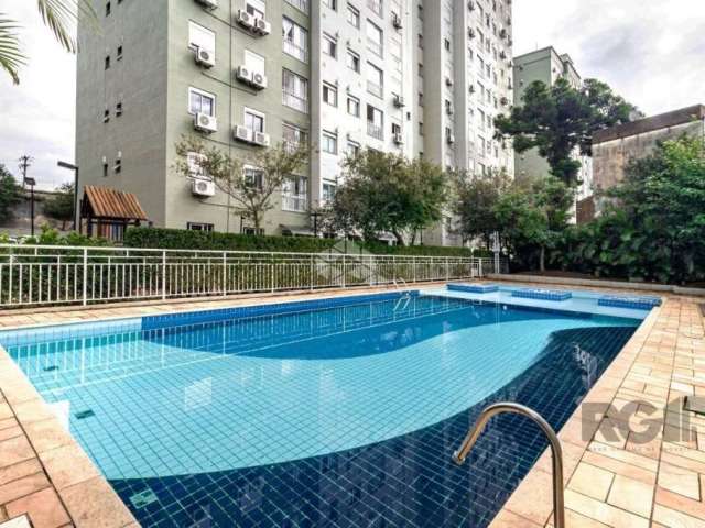 Apartamento 02 dormitórios localizado no bairro Glória em Porto Alegre .Living para dois ambientes e janela até o chão, cozinha americana com churrasqueira, área de serviço com tanque e ligação para a