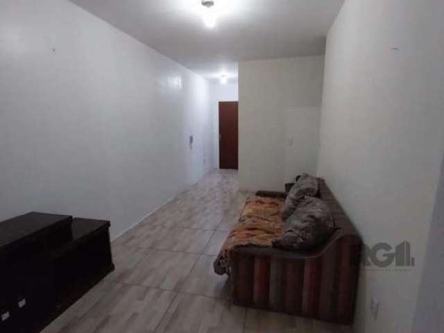 Apartamento terreo, com 1 dormitório, pátio amplo e coberto, living dois ambientes bem definidos, cozinha ampla e 1 banheiro.&lt;BR&gt;Prédio localizado junto a Orla do Guaíba e Cais Embarcadeiro. Jun