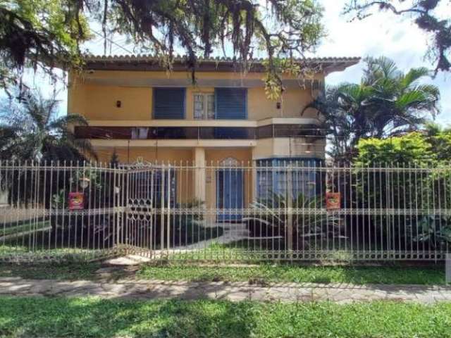 Casa com 3 quartos à venda na Travessa Trindade, 40, Jardim Lindóia, Porto Alegre por R$ 1.300.000