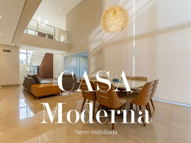 Casa moderna com área de lazer e ambientes amplos