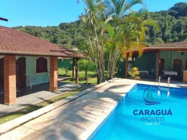 Casa de 4 dormitórios, mais um reversível, com 300m² e 720m² de terreno no Residencial VerdeMar, Massaguaçu, Caraguatatuba - SP