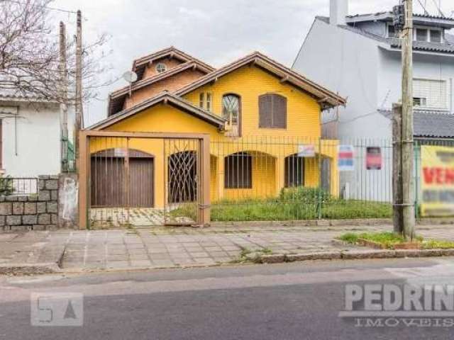 Casa com 4 quartos à venda no Nonoai, Porto Alegre  por R$ 960.000