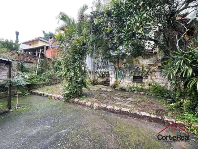 Casa com 4 quartos à venda na Rua Oscar Tollens, 63, Santa Tereza, Porto Alegre por R$ 700.000