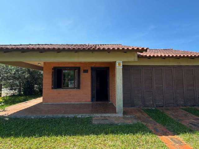 Casa em condomínio fechado com 3 quartos à venda na Rua Cel. Virgílio Carneiro Borges, 274, Remanso, Xangri-Lá por R$ 595.000