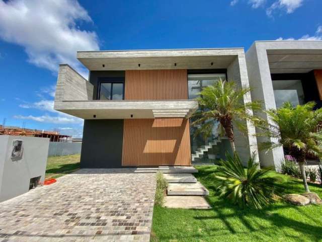 Esta deslumbrante casa de alto padrão está disponível para venda no prestigiado condomínio Sunset, em Xangri-Lá, Rio Grande do Sul. Com quatro suítes espaçosas e cinco banheiros, esta residência ofere