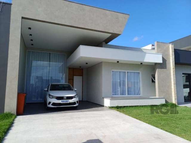 Casa à venda no Condomínio Sunset, localizado na rua Rio Camisas, Centro, Xangri-Lá. Com 3 quartos, sendo 2 suítes, 4 banheiros, 2 vagas de garagem. Área privativa de 150m² e área total de 180m². Exce