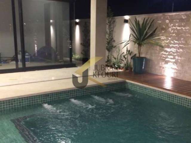 Casa à venda em condomínio de Hortolândia, 4 suítes, piscina e 4 garagens