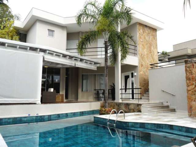 Casa à venda no Alphaville Campinas, 4 suítes (1 master com varanda), piscina e espaço gourmet