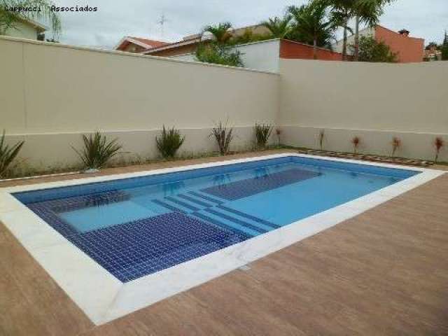 Casa à venda no Alphaville com 4 suítes, piscina, espaço gourmet e garagem para vários carros.