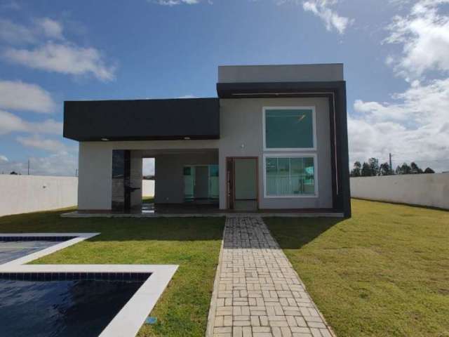 Venha conhecer essa casa espetacular, 3 suítes, sala com pé direito duplo. Condomínio Jacuípe Country-Barra do Jacuípe