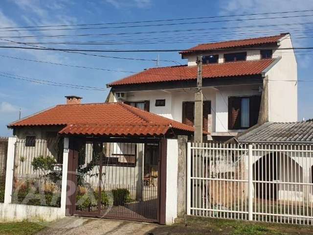 Casa com 3 quartos à venda na Augusto, 13, Guajuviras, Canoas por R$ 474.000