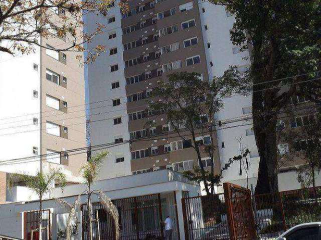 No Sy Condomínio Praça, vendo apartamento de dois dormitórios, suíte, com piso, móveis fixos na cozinha, zona sul de Porto Alegre