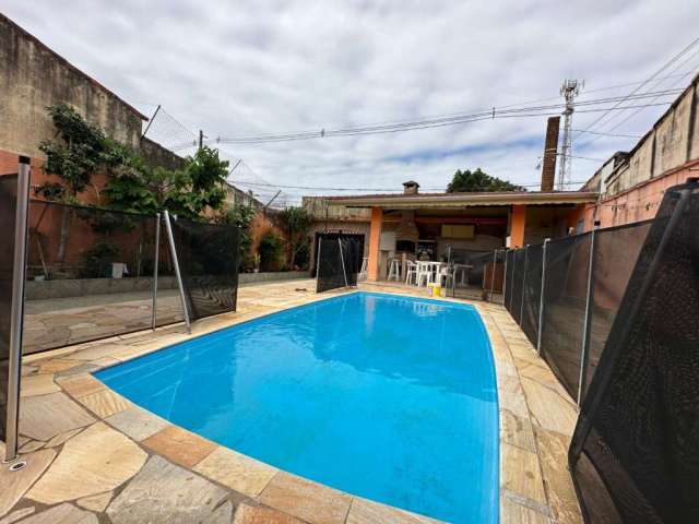 Casa com 3 dormitórios e piscina à venda por R$ 609.000 - Belas Artes - Itanhaém/SP