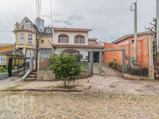 Casa com 4 quartos à venda na Rua Esteio, 220, Cavalhada, Porto Alegre, 244 m2 por R$ 810.000