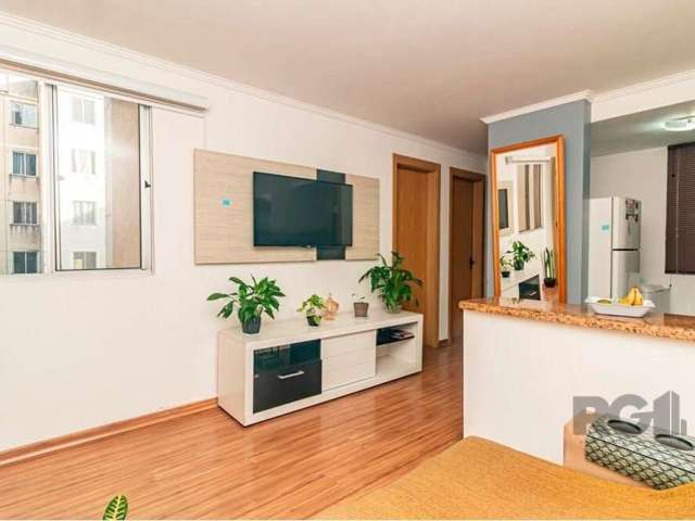 Apartamento no bairro Jardim Leopoldina Aconchegante apartamento com 2 dormitórios, sala ampla para 2 ambientes, cozinha estilo americana, conceito aberto e 1 banheiro, pintado recentemente, andar com