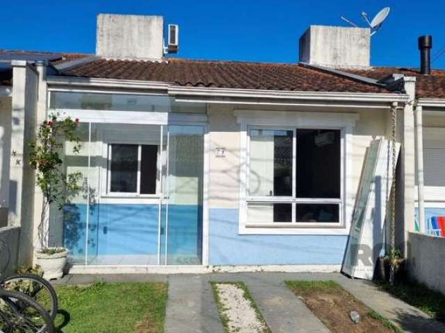 Casa em condomínio com 2 quartos, vaga de garagem, no bairro Aberta dos Morros, Porto Alegre/RS&lt;BR&gt;&lt;BR&gt;Esta aconchegante casa dispõe de 2 dormitórios iluminados, uma sala espaçosa e uma co