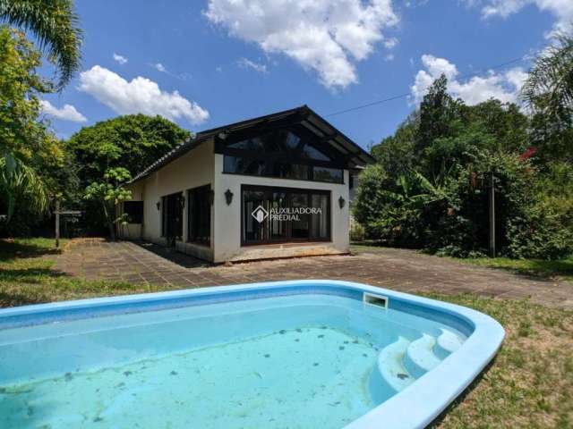 Casa em condomínio fechado com 5 quartos à venda na PITANGUEIRA, 206, São Lucas, Viamão, 249 m2 por R$ 700.000