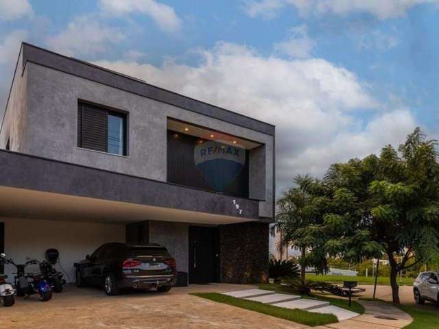 Casa à venda Condomínio Giverny, 303 m² terreno, 252 m² construída, 4 suítes sendo 1 no térreo, 4 vagas, 6 banheiros e piscina.