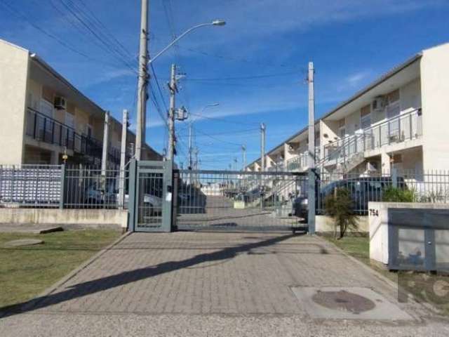 Casa em andar térreo em condomínio fechado, semi mobiliada no Bairro Aberta dos Morros, de 2 dormitórios, living para dois ambientes, banheiro com box de vidro e moveis, cozinha com moveis. Pátio aos 