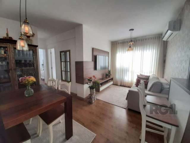 Apartamento com 2 dormitórios e 1 suíte no bairro Azenha/Menino Deus em Porto Alegre. Living 2 ambientes, cozinha americana com lavanderia,  semi mobiliado com  móveis sob medida de excelente qualidad