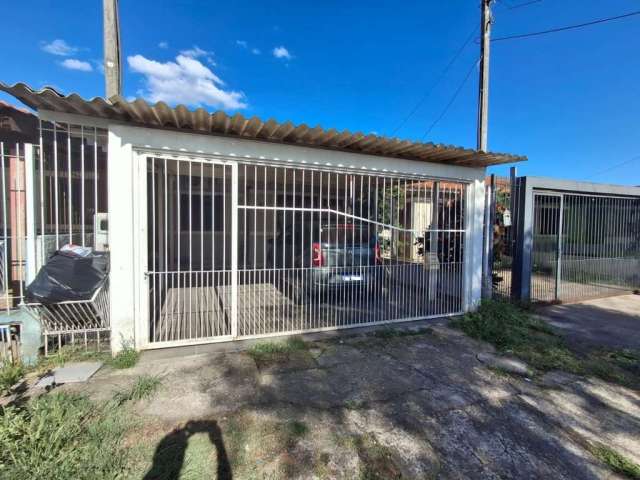 Casa a Venda no Loteamento Moradas do Sul, com 2 dormitórios, amplo living, cozinha com moveis planejados, banheiro social com box de vidro, 2 vagas de garagem  cobertas e com portão de contrapeso, pá