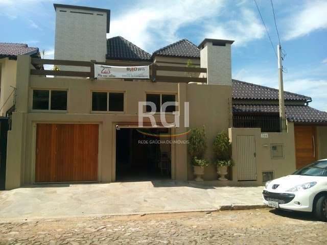 Sobrado com 03 dormitórios (03 suítes), no bairro Jardim  América, em São Leopoldo. &lt;BR&gt;Térreo: Hall de entrada, lavabo, escritório, sala de estar, janta e cozinha, suíte master e sala de tv. Ga