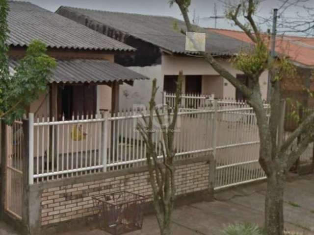 Casa a venda no bairro Guajuviras em Canoas.&lt;BR&gt;Casa com 2 dormitórios, com sala, cozinha, área de serviço, salão de festas ,pátio, 1 vaga de garagem, com espaço também para moto.