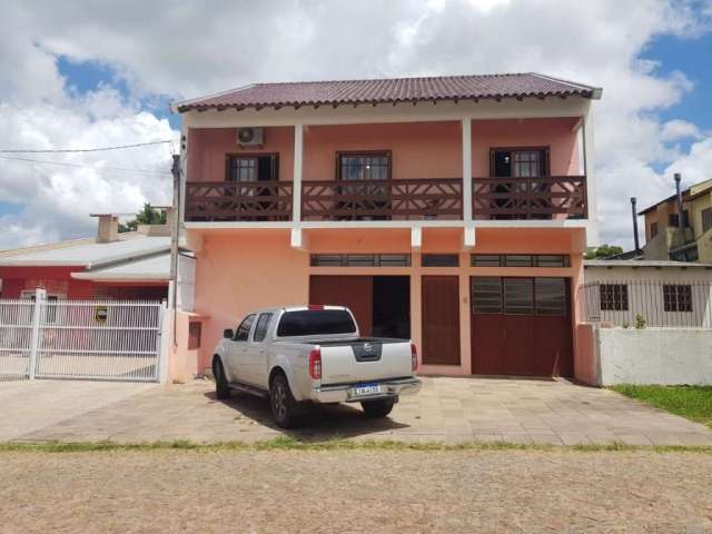 Belíssimo Imóvel com anexo comercial próximo ao centro de Viamão.&lt;BR&gt;&lt;BR&gt;Imóvel possui 3 dormitórios, sala de estar, sala de jantar, cozinha, espaço Gourmet com churrasqueira e fogão a len