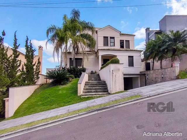 Linda casa semi mobiliada, com 4 suítes, sendo uma no andar térreo e as outras no segundo pavimento, living 2 ambientes com lareira e churrasqueira, cozinha planejada, área de serviço, lavabo, amplo p