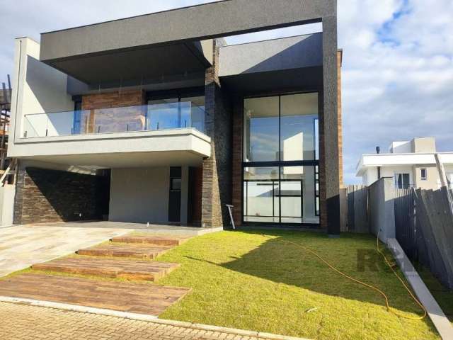 Belíssima casa no condomínio City Park. Com 242m², conceito aberto, sala de jantar com espera para ilha; sala com pé direito duplo, lareira, porta janela na frente; lavabo; home office com entrada ind