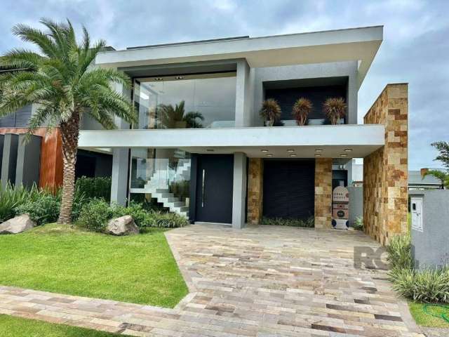 Não deixe escapar esta oportunidade única de adquirir uma casa de luxo no prestigiado Capão Ilhas Resort em Capão da Canoa. Esta magnífica residência oferece quatro dormitórios, todos eles suítes, gar