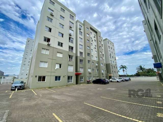 Apartamento em Torres  com três dormitórios sendo uma suite , living com dois ambientes , banho social , cozinha com churrasqueira , vaga para  um carro , condominio com infra , pracinha e espaço  gou