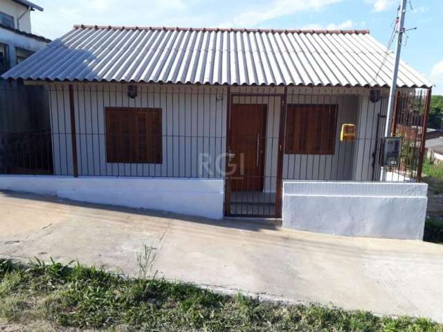 No centro de Viamao casa Térrea.&lt;BR&gt;Casa térrea com living para dois ambientes, banheiro, cozinha com área de serviço, e dois dormitórios.&lt;BR&gt;E um belo patio.&lt;BR&gt;Vai perder???????